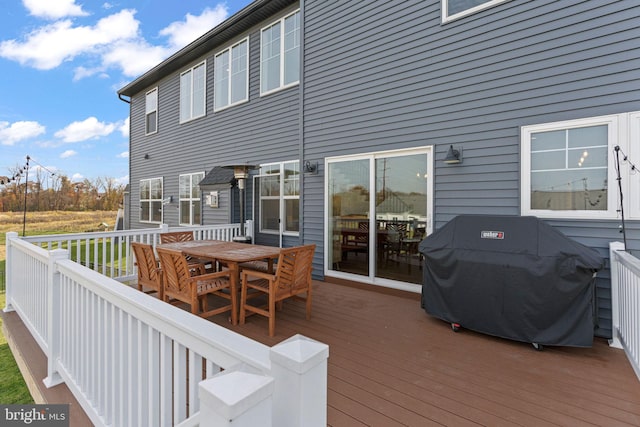 wooden terrace featuring grilling area