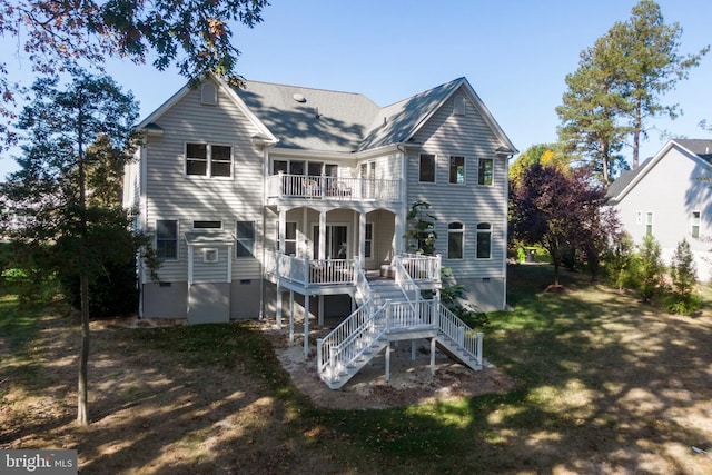 rear view of property with a balcony