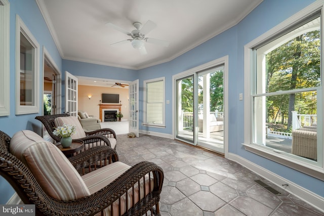 sunroom / solarium with ceiling fan