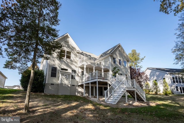 back of house featuring a deck