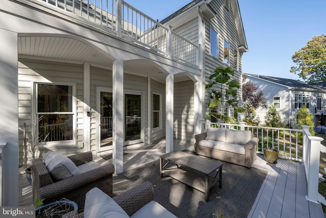 wooden deck featuring outdoor lounge area