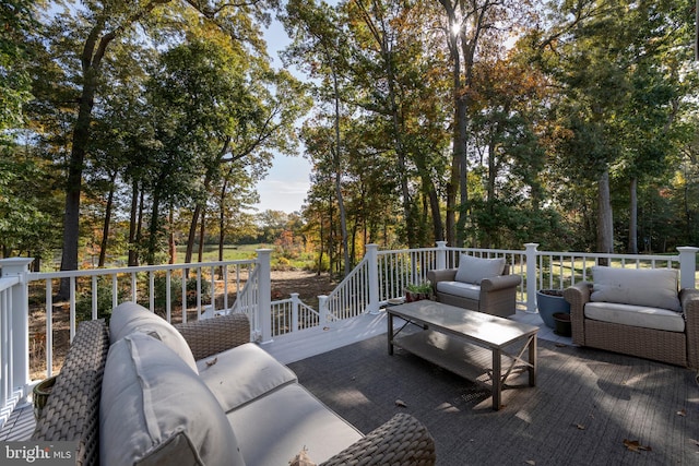 view of patio featuring a wooden deck and outdoor lounge area