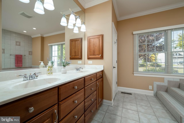 bathroom featuring vanity, ornamental molding, and tile patterned flooring