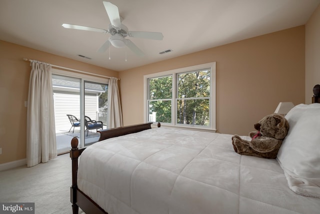 bedroom with access to exterior, light colored carpet, and ceiling fan