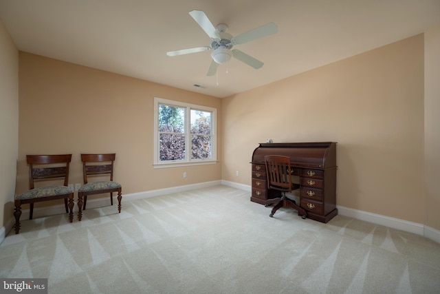 office space featuring light colored carpet and ceiling fan