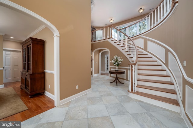 foyer featuring crown molding