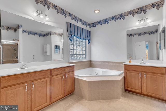 bathroom featuring vanity, shower with separate bathtub, and tile patterned floors