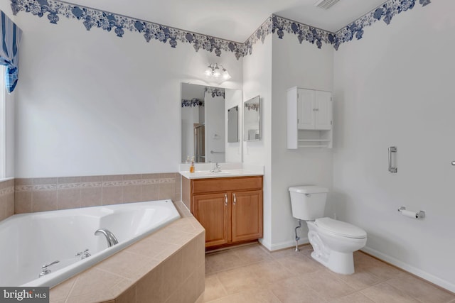 bathroom with vanity, tiled tub, toilet, and tile patterned flooring