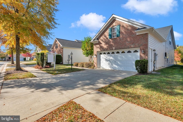 view of front property with a front yard and a garage