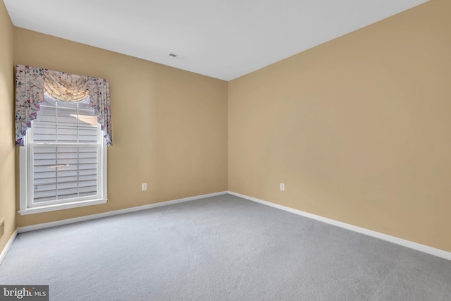 empty room featuring carpet floors