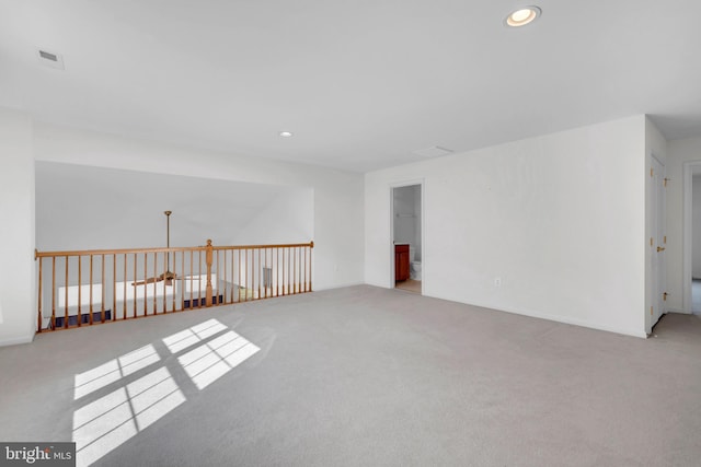 empty room with light colored carpet