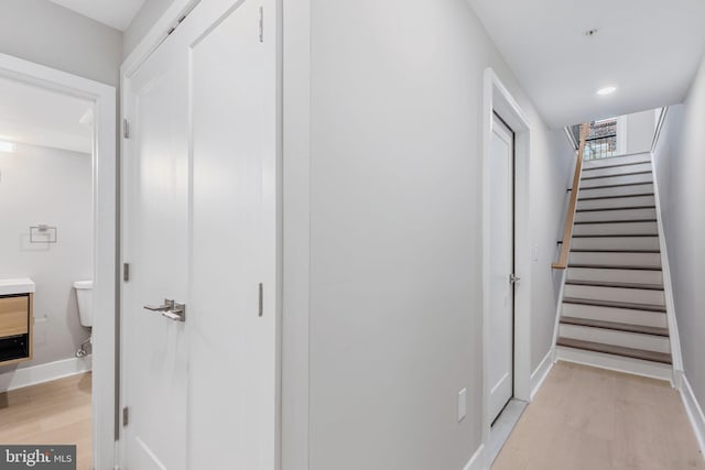 hall with light hardwood / wood-style flooring