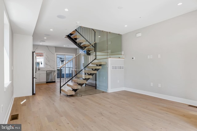 stairway featuring hardwood / wood-style floors