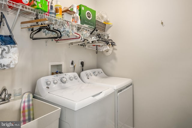 laundry room featuring sink and washing machine and clothes dryer