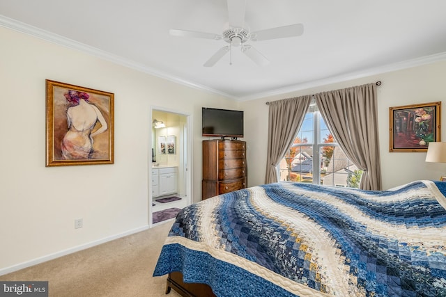 carpeted bedroom with ensuite bathroom, ornamental molding, and ceiling fan