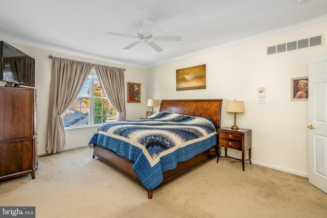 bedroom featuring carpet, crown molding, and ceiling fan