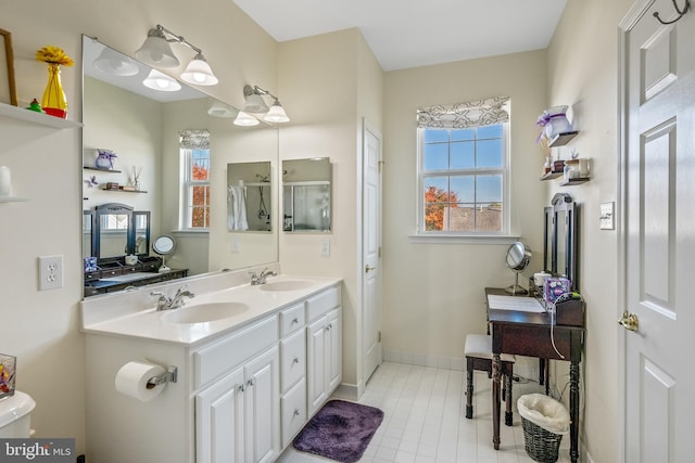 bathroom featuring vanity, toilet, and tile patterned flooring