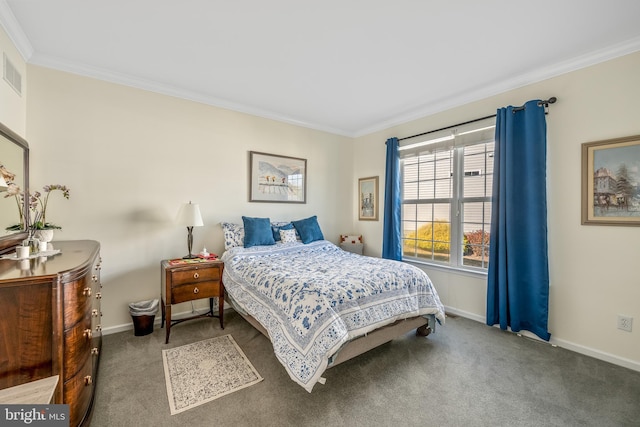 bedroom with ornamental molding and carpet floors