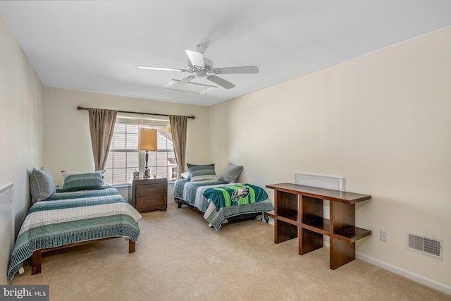 bedroom with light carpet and ceiling fan