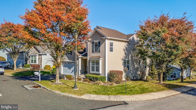 view of property featuring a front yard