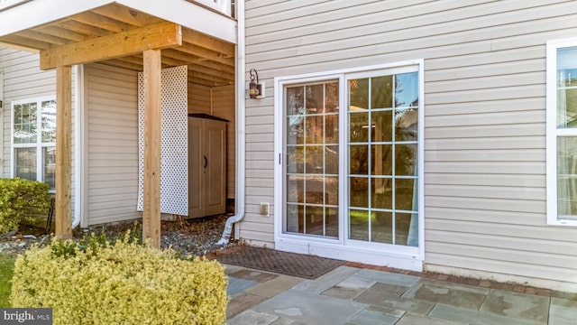 doorway to property with a patio area