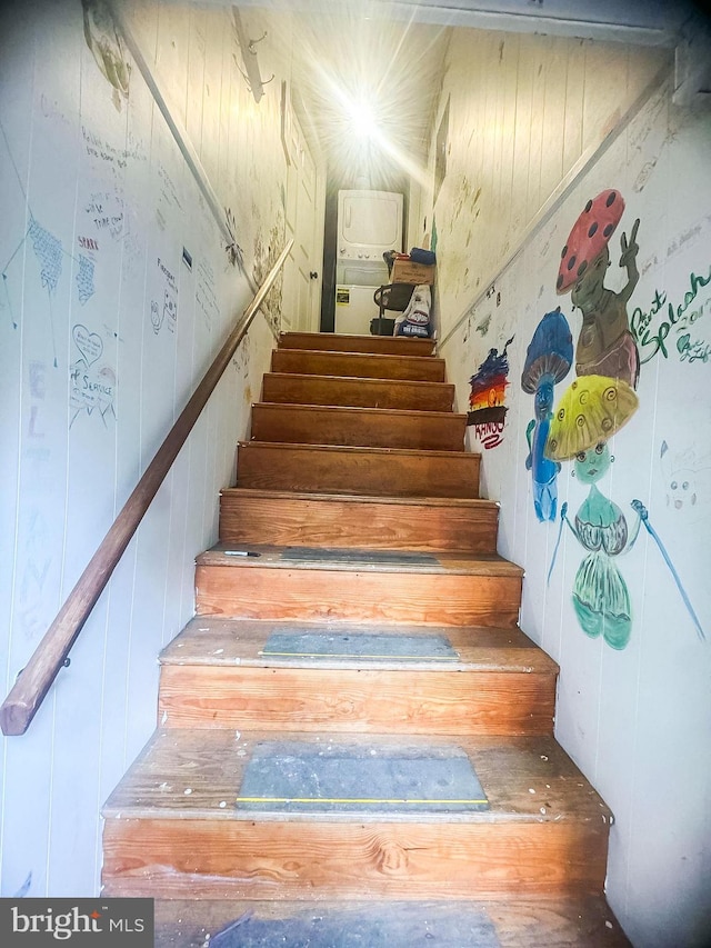 stairway with hardwood / wood-style flooring