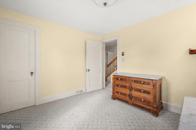 bedroom with light colored carpet