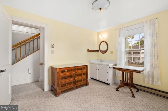 bathroom featuring vanity and baseboard heating