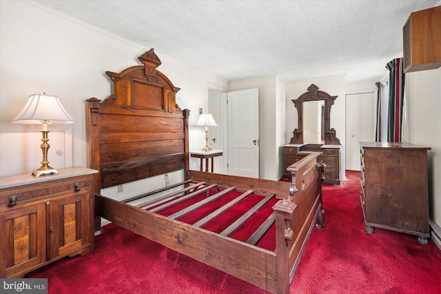 carpeted bedroom featuring a textured ceiling