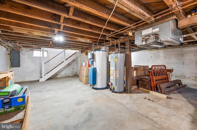 basement featuring water heater, stairs, and electric panel