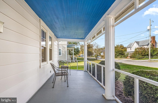 unfurnished sunroom featuring wooden ceiling