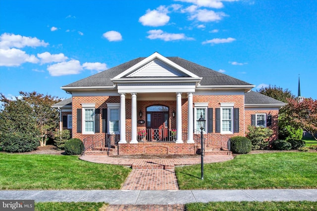 neoclassical home with a front yard