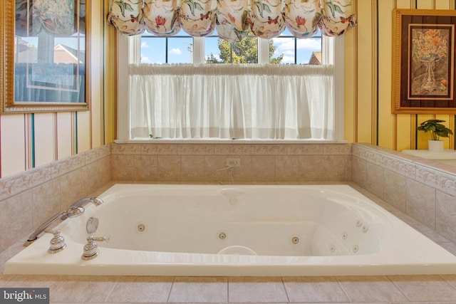 bathroom featuring tiled tub