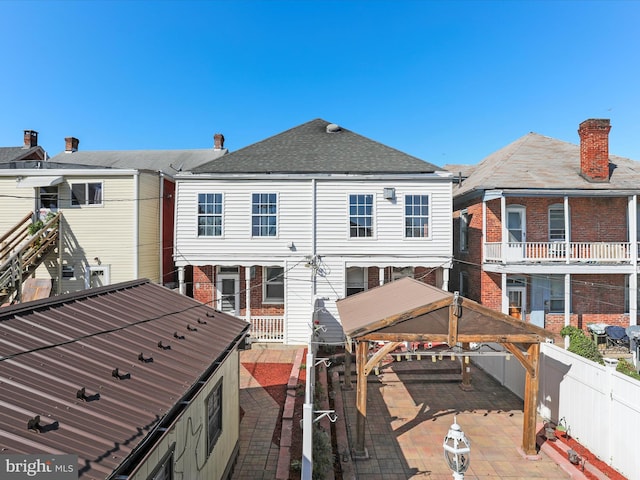 back of house featuring a patio and a gazebo