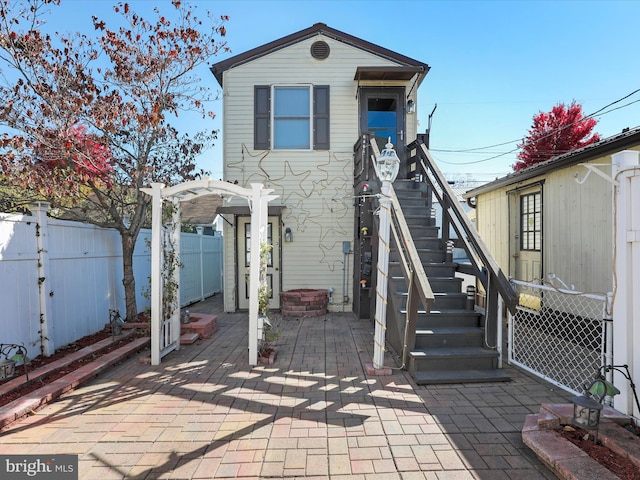 exterior space with a patio area and a pergola