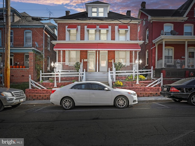 multi unit property featuring a porch