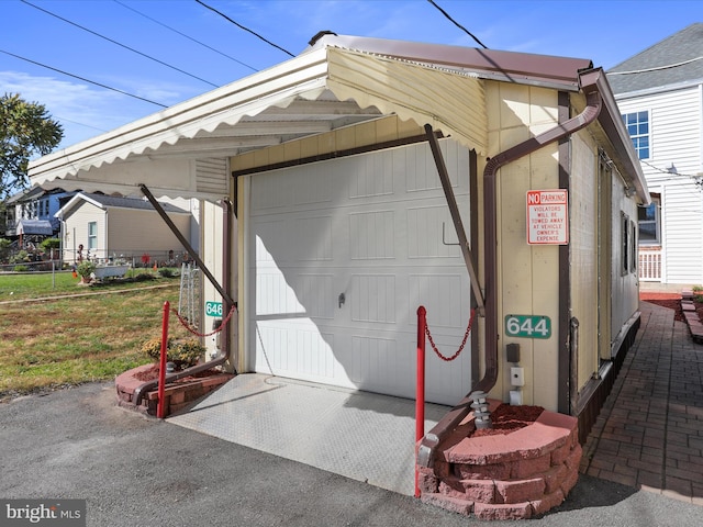 garage with a lawn