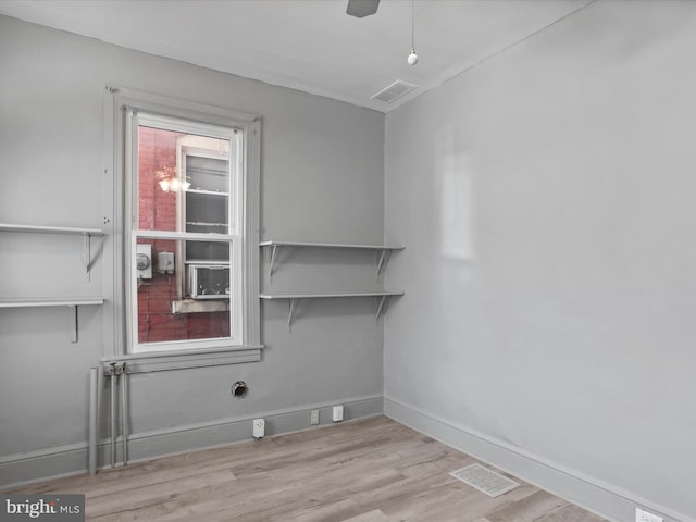 empty room with light hardwood / wood-style flooring