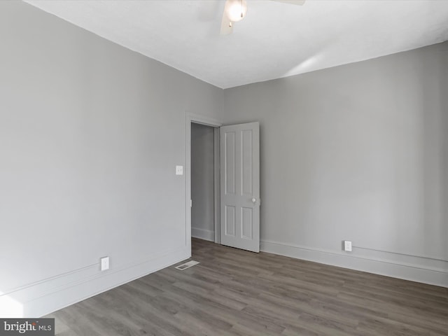 spare room featuring hardwood / wood-style flooring and ceiling fan