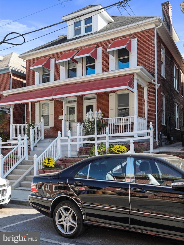 townhome / multi-family property with covered porch