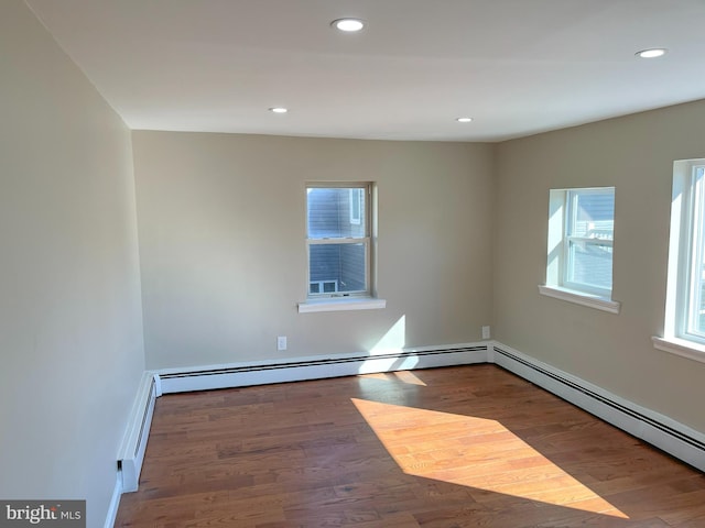 unfurnished room featuring hardwood / wood-style flooring