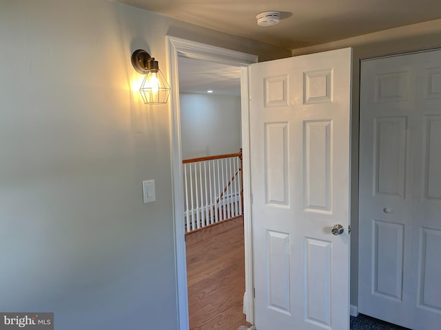 hall with hardwood / wood-style flooring