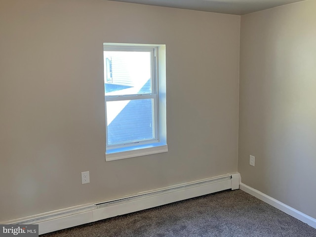 unfurnished room featuring baseboard heating and carpet