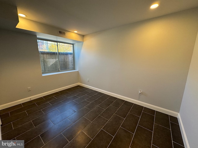 spare room featuring dark hardwood / wood-style floors