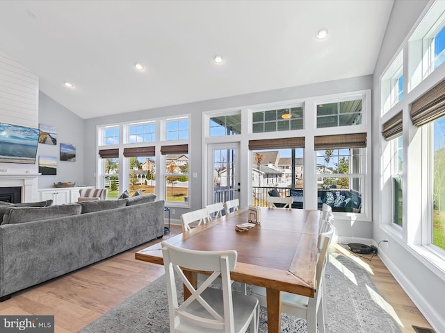30579 Canary Way Unit 5, Ocean View, DE 19970 - dining space with healthy amount of natural light, light wood-style floors, recessed lighting, a fireplace, and high vaulted ceiling