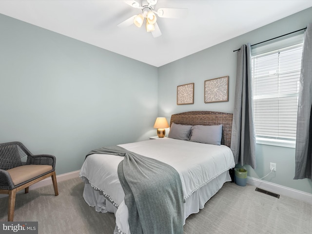 bedroom featuring ceiling fan and light colored carpet