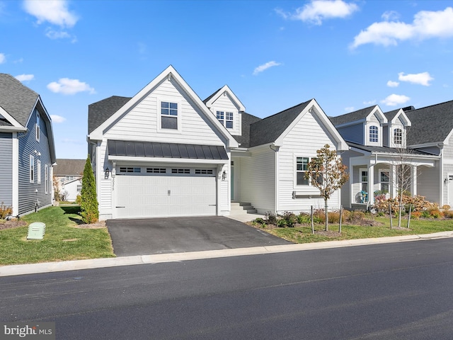 view of front of home featuring a front yard and a garage