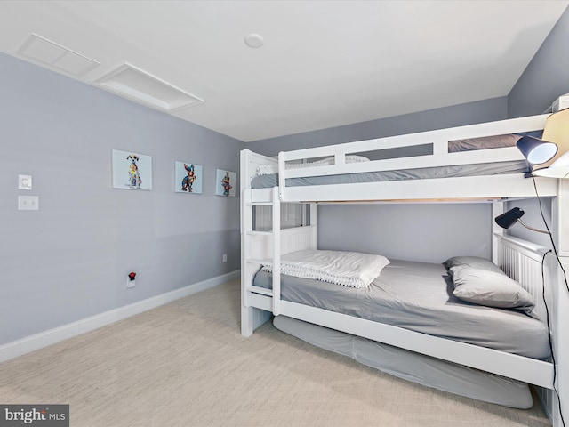 bedroom featuring light carpet