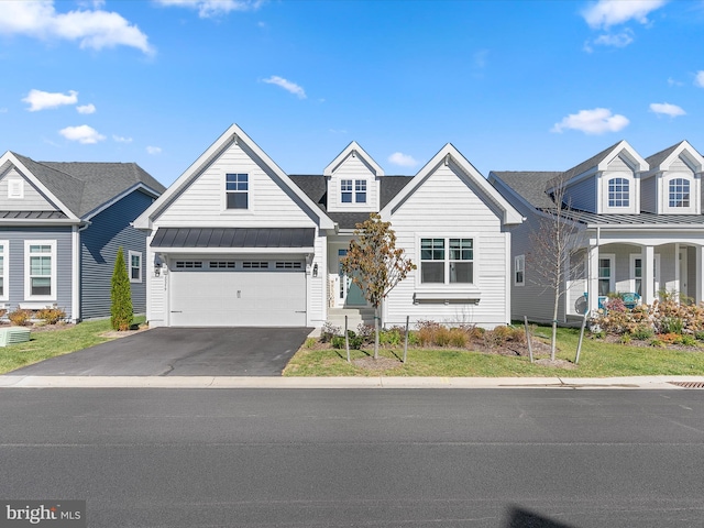 30579 Canary Way Unit 5, Ocean View, DE 19970 - view of front of property featuring asphalt driveway, a standing seam roof, a garage, and metal roof