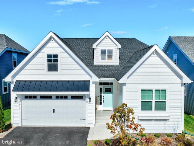 30579 Canary Way Unit 5, Ocean View, DE 19970 - view of front of house with roof with shingles, a standing seam roof, a garage, and metal roof